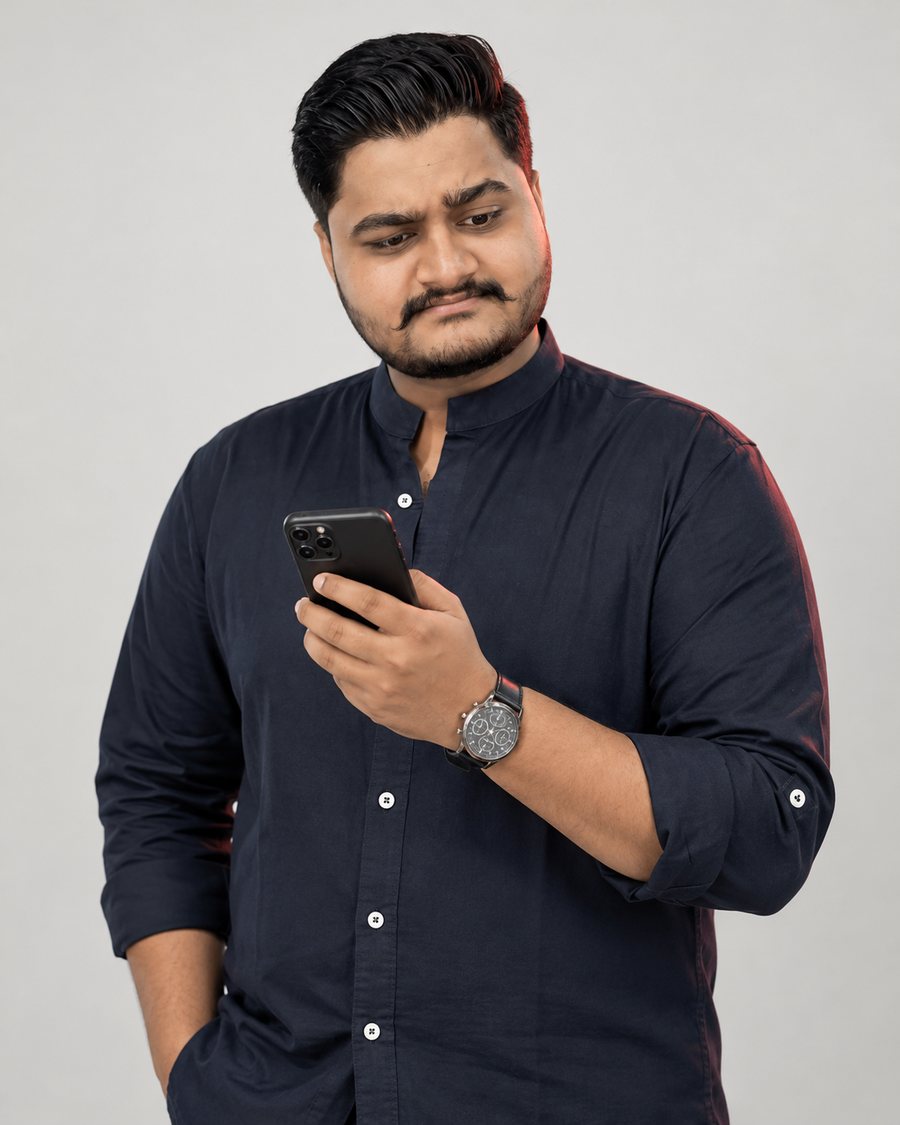 Dwarkesh reading on his phone